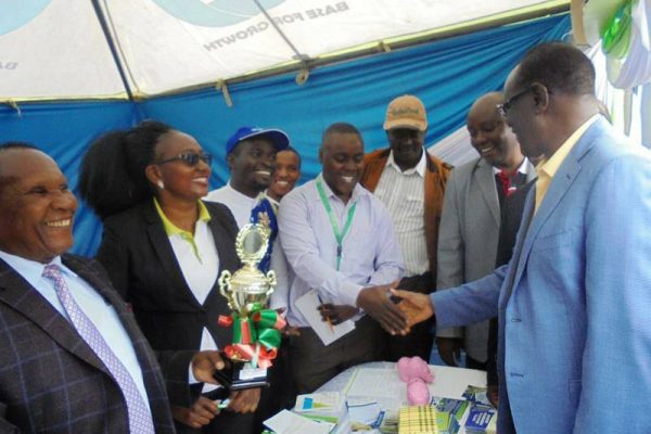 Capital Sacco family happily receiving trophies From the Meru County Governor Governor Kiraitu Murungi during the 2019 Ushirika Day Celebrations.